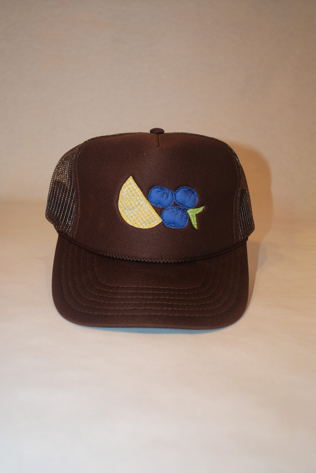 BROWN LEMON BLUEBERRY TRUCKER HAT