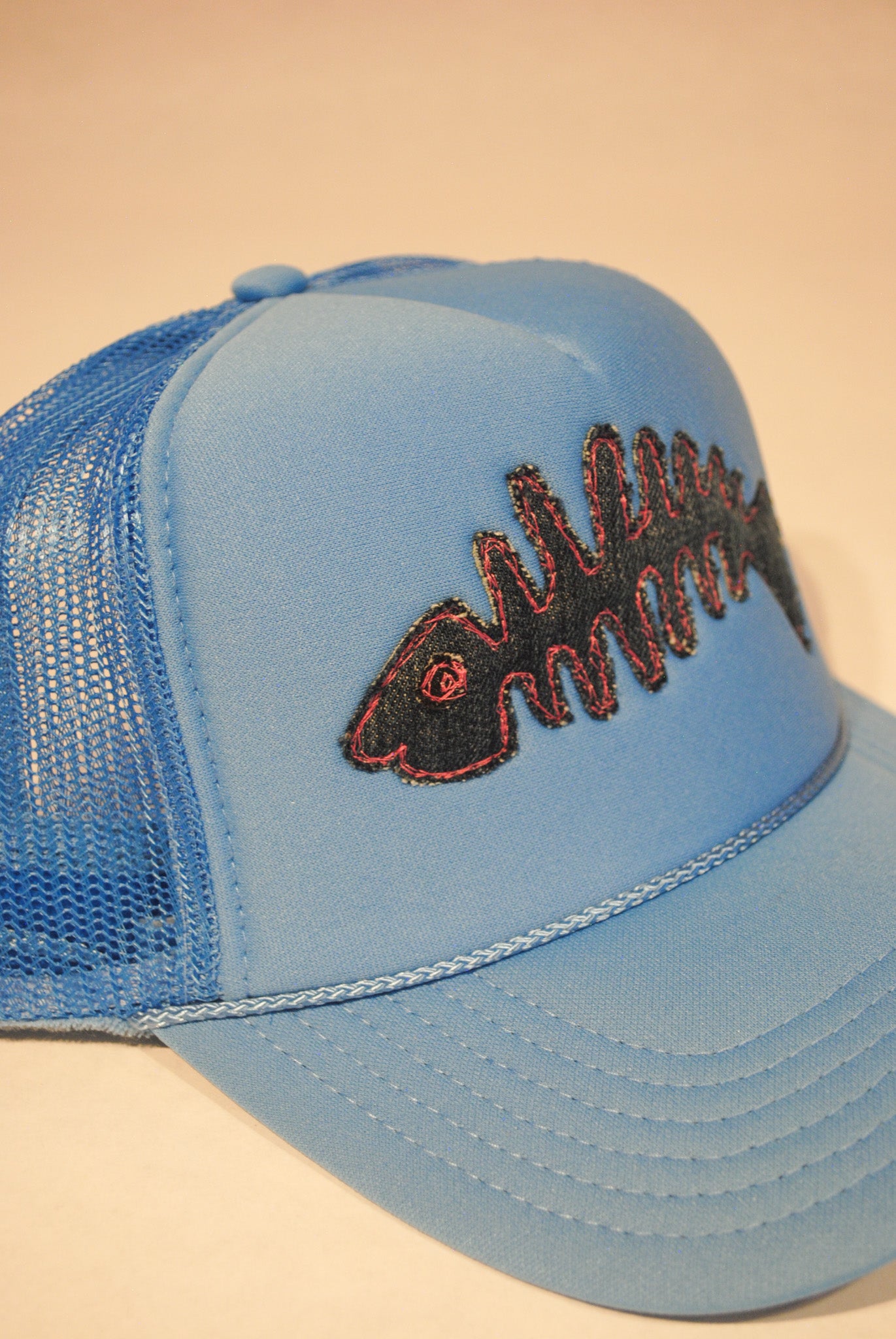 LIGHT BLUE FISH SKELLY TRUCKER HAT DENIM